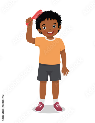 Cute little African boy combing her hair with comb