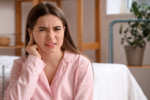 Young woman with otitis in ...