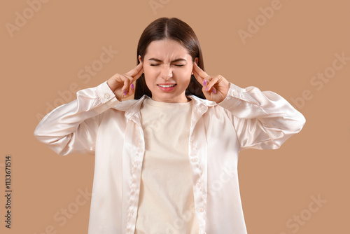 Young woman feeling pain in...