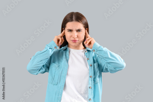 Young woman with otitis on ...