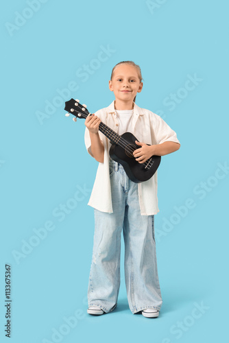 Little girl playing guitar ...