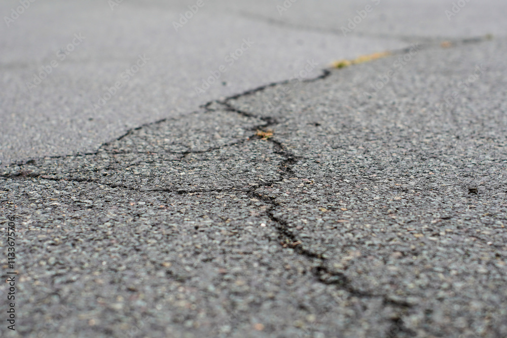Crack in grey concrete surface Crack in grey concrete surface