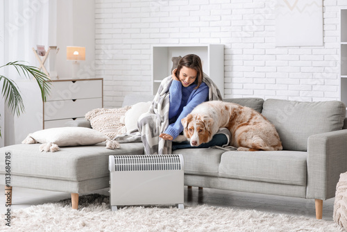 Young woman with blanket an...