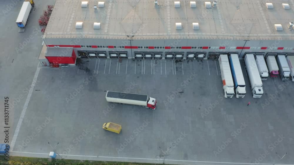 Modern logistics park with semi trucks at loading ramps, warehouse ...