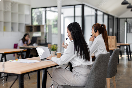 Asian call center team, customer service, telesales wearing headset or headphone talking with customer in the office. Customer Service Representative, Service, Call Center, 
