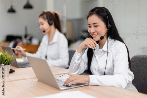 Asian call center team, customer service, telesales wearing headset or headphone talking with customer in the office. Customer Service Representative, Service, Call Center, 