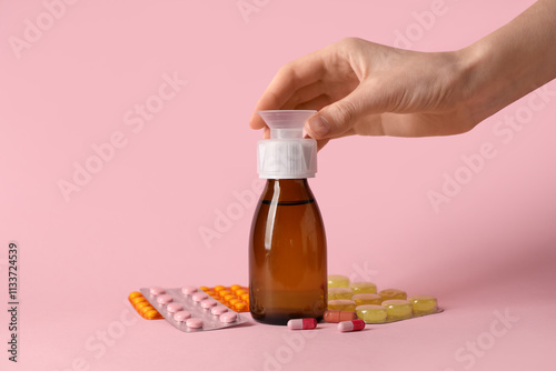 Female hand with bottle of ...