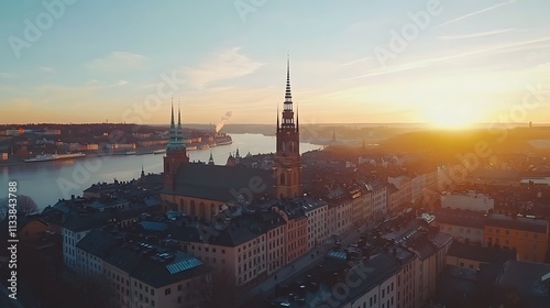 Golden Hour over Stockholm: A Panoramic View of Riddarholmen Church and the Cityscape at Sunset