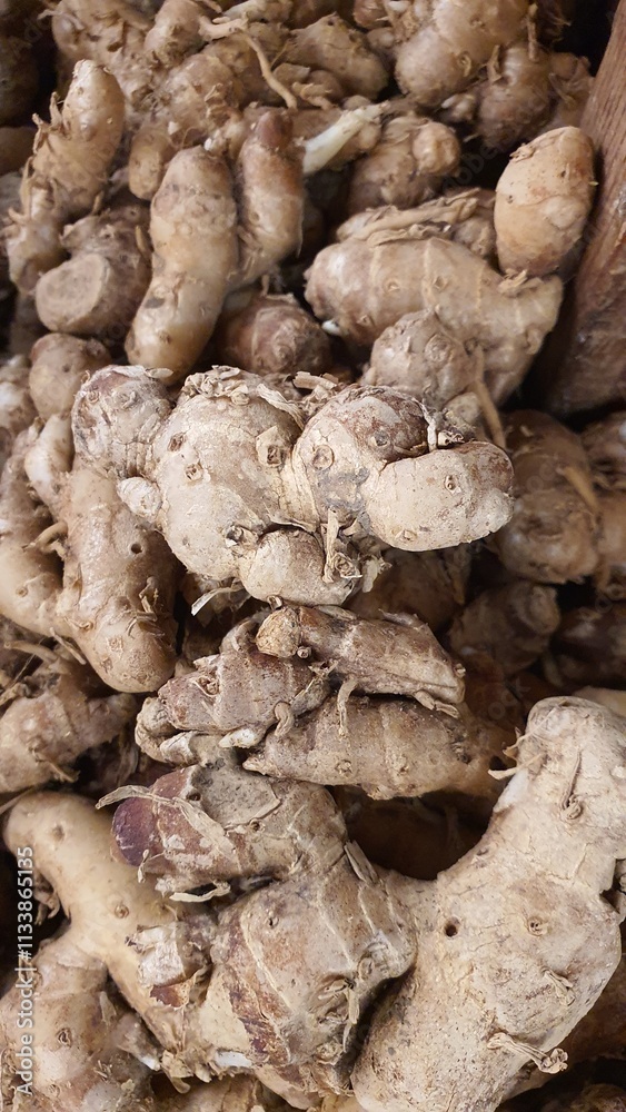 Close up pile of tasty fresh ginger sold at the market as a background. Close up pile of tasty fresh ginger sold at the market as a background.