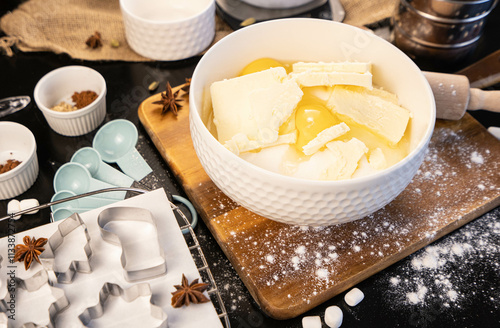 Christmas gingerbread cooking preparation. All needed ingredients in the bawl, eggs, flour, butter and sugar