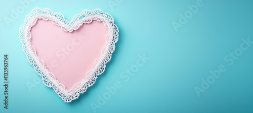 Heart shaped frame with intricate lace border on blue background