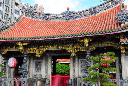 TAIPEI, TAIWAN :DECEMBER  09 2024: Lungshan Temple of Manka is a Chinese folk religious temple in Taipei, Taiwan. Lungshan Temple or Mengjia Longshan Temple is one of largest and oldest in Taipei. photo