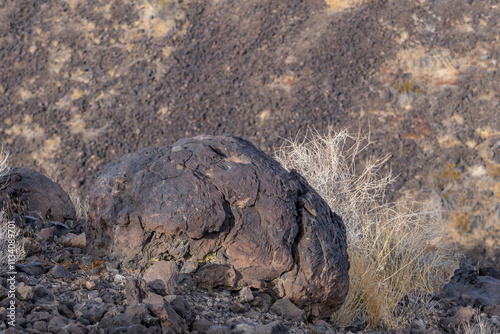 A volcanic bomb or lava bomb. Cima volcanic field. Kelbaker Road, Mojave National Preserve. San Bernardino County, California. Mojave Desert / Basin and Range Province. photo