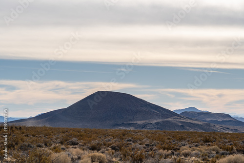 Cinder Cone / Scoria Cone with Lava Flow. Cima volcanic field. Kelbaker Road, Mojave National Preserve. San Bernardino County, California. Mojave Desert / Basin and Range Province.  photo