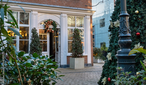 entrance cafe shop Christmas decorations tree wreath front doors The Hague