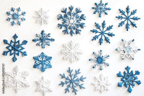 Decoratively arranged blue and white snowflakes on a white background creating a winter theme