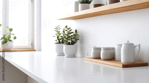 A clean, white frame on a minimalist kitchen counter, with modern appliances and a bright, organized space Minimalist kitchen in soft pastel hues with floating shelves displaying ceramics and plants, 