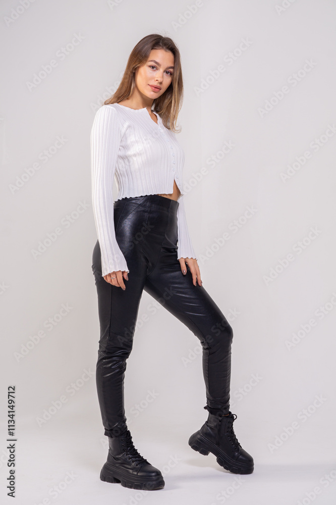 Attractive brunette young woman standing on a white background. Copy space Attractive brunette young woman standing on a white background. Copy space