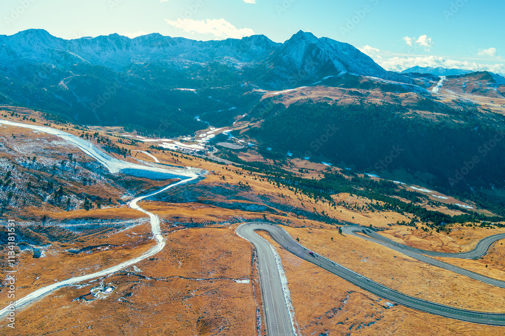 Mountain landscape on a sunny autumn day. View of highway in Pyrenees mountains, Andorra, Europe