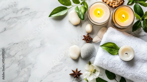 A serene spa arrangement featuring candles, stones, and greenery, creating a calming atmosphere for relaxation and wellness.