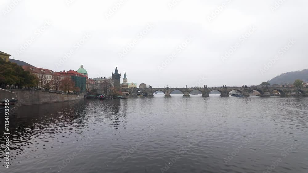 Charles Bridge in Prague from a sightseeing boat sailing on the Vltava River, Czechia. Charles Bridge in Prague from a sightseeing boat sailing on the Vltava River, Czechia.