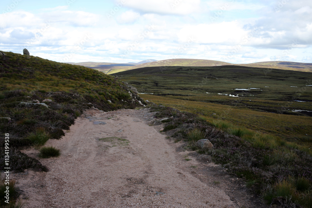 Trail between Broad Cairn summit, Loch Muick and Spittal of Glenmuick in the background - Aberdeenshire - Scotland - UK Trail between Broad Cairn summit, Loch Muick and Spittal of Glenmuick in the background - Aberdeenshire - Scotland - UK