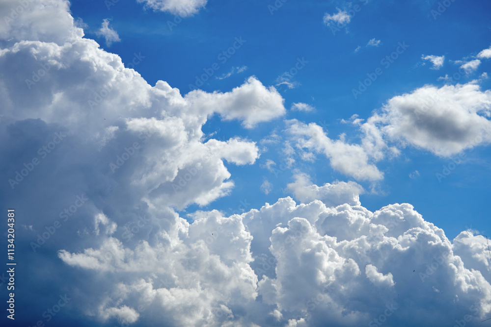 Cumulus clouds. White clouds on the blue sky close-up. Cumulus clouds. White clouds on the blue sky close-up.