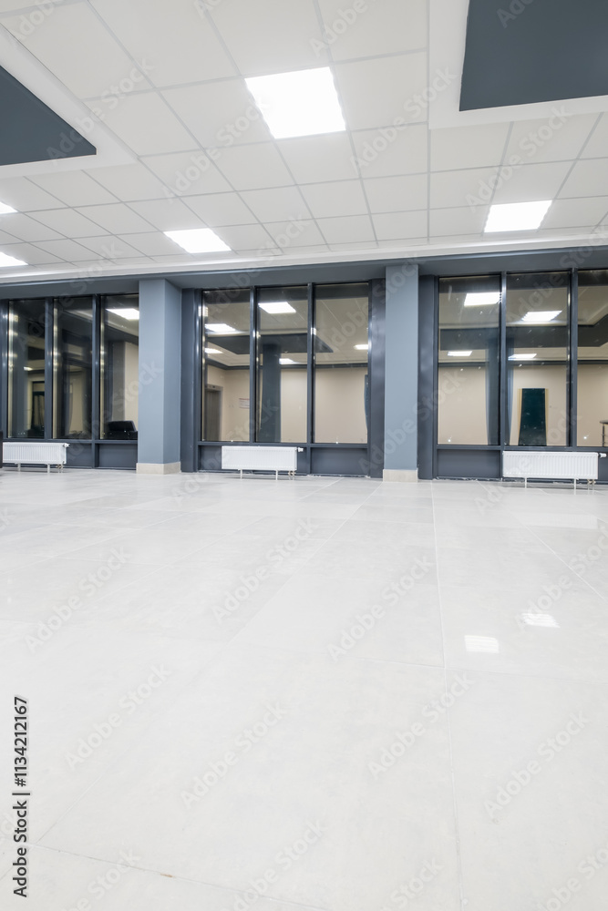 panorama view in empty modern hall with columns, doors and panoramic windows at night panorama view in empty modern hall with columns, doors and panoramic windows at night