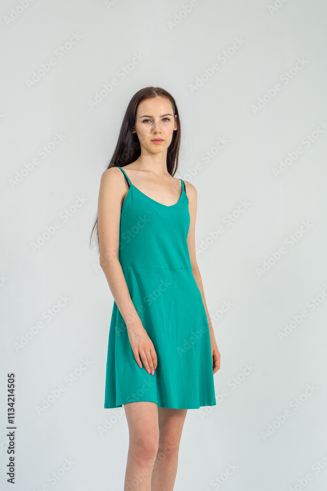 Slim cute young woman standing on a white background. Copy space Slim cute young woman standing on a white background. Copy space
