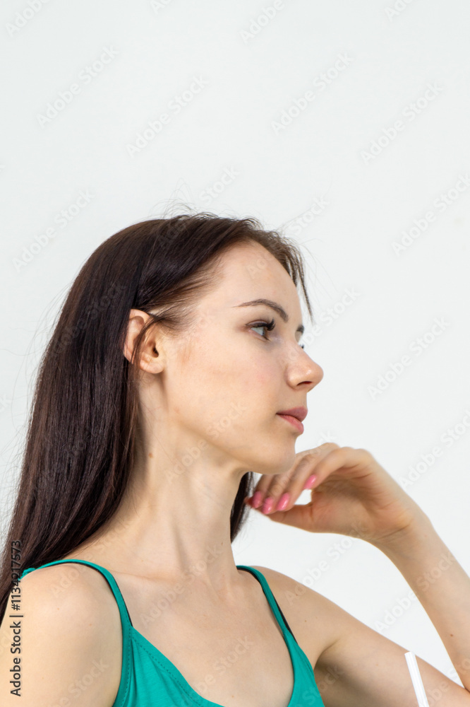 Close-up face portrait of pretty skinny young brunette girl on white background Close-up face portrait of pretty skinny young brunette girl on white background