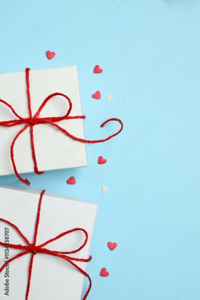 Gift boxes with red hearts on color background Gift boxes with red hearts on color background