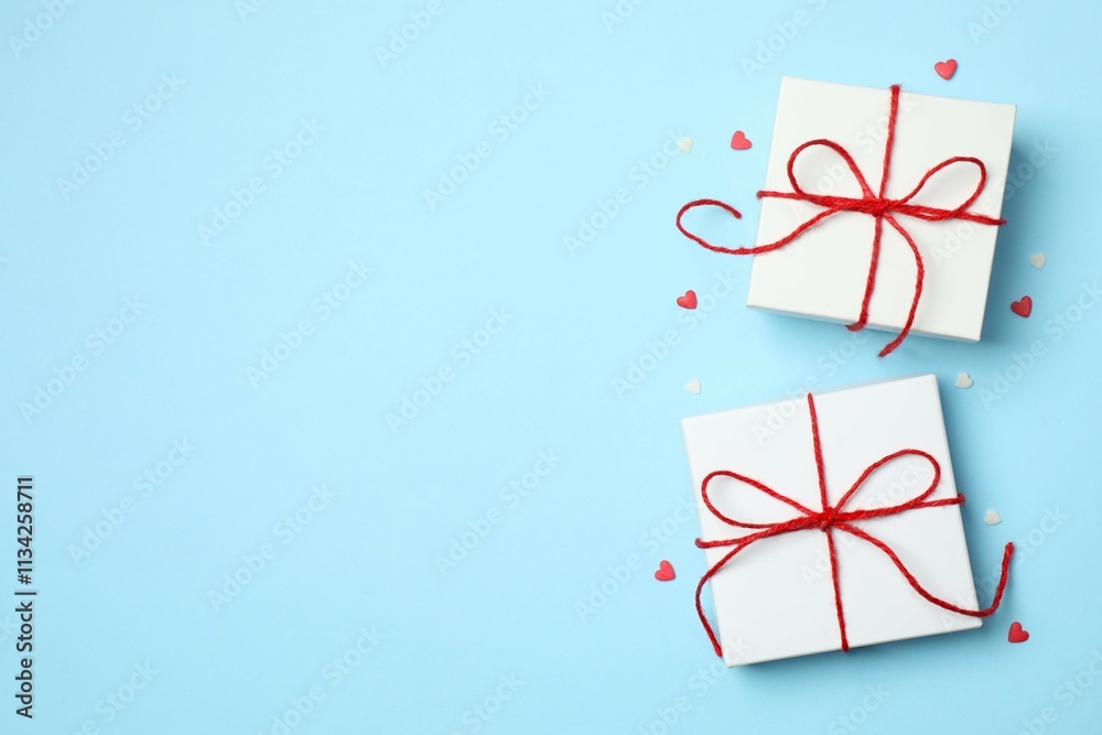 Gift boxes with red hearts on color background Gift boxes with red hearts on color background