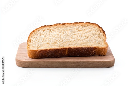 Freshly baked bread slice resting on a wooden cutting board against a white background