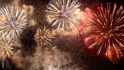 Amazing real beautiful colorful fireworks background on celebration night event for happy new year party, Abstract Multi color golden firework in the night sky