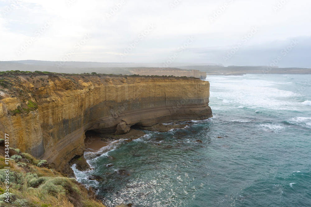 The Bakers Oven so called for the shape of the natural arch in the cliff face. A sea stack on the coast of the Great ocean Road, Australia. The Bakers Oven so called for the shape of the natural arch in the cliff face. A sea stack on the coast of the Great ocean Road, Australia.