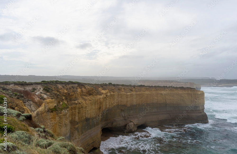 The Bakers Oven so called for the shape of the natural arch in the cliff face. A sea stack on the coast of the Great ocean Road, Australia. The Bakers Oven so called for the shape of the natural arch in the cliff face. A sea stack on the coast of the Great ocean Road, Australia.