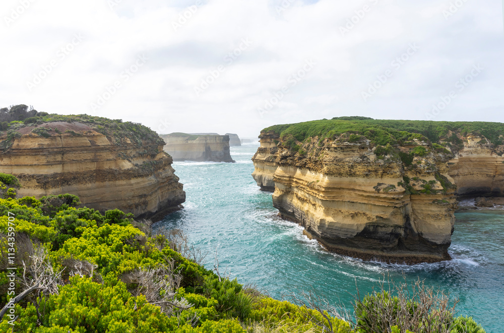 Fototapeta premium Mutton Bird Island Lookout with blue sky at Port Campbell National Park in Victoria, Australia.