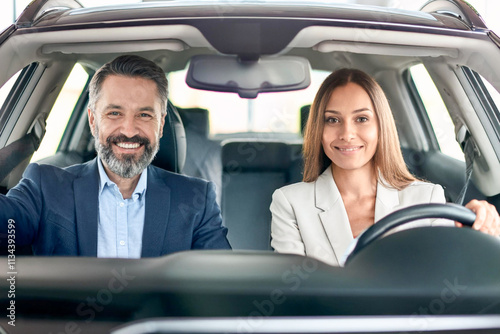 front portrait of happy couple sitting in luxury car new man and woman enjoying road trip people in vehicle