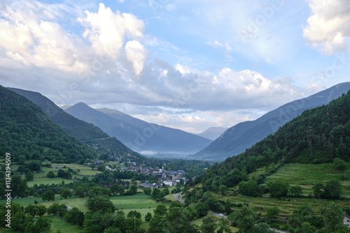 village of torla surrounded by mountains at sunrise in the Ordesa valley, Aragon, Spain