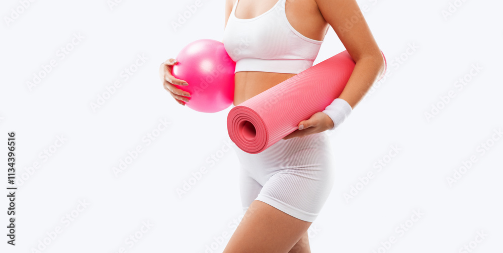 Beautiful attractive girl in white shorts and a top on a white background. The concept of sports and healthy lifestyle. Beautiful attractive girl in white shorts and a top on a white background. The concept of sports and healthy lifestyle.