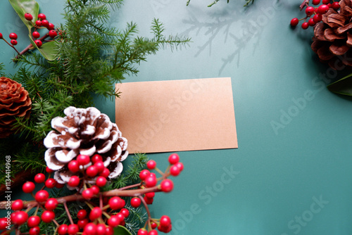 winter holiday natural leaves, berries and pine cone decoration background. winter holiday and Merry Christmas decorative background with greeting card.