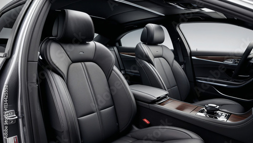 The front seats and headrests in this modern car interior are incredibly comfortable, with sleek black leather upholstery and an elegant design perfect for a luxurious ride