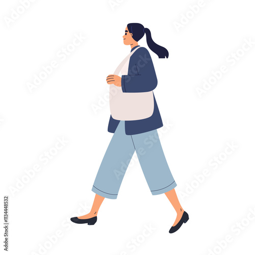 Woman walks holding a bag over her shoulder