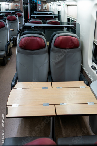 Empty seats and a table in a passenger carriage