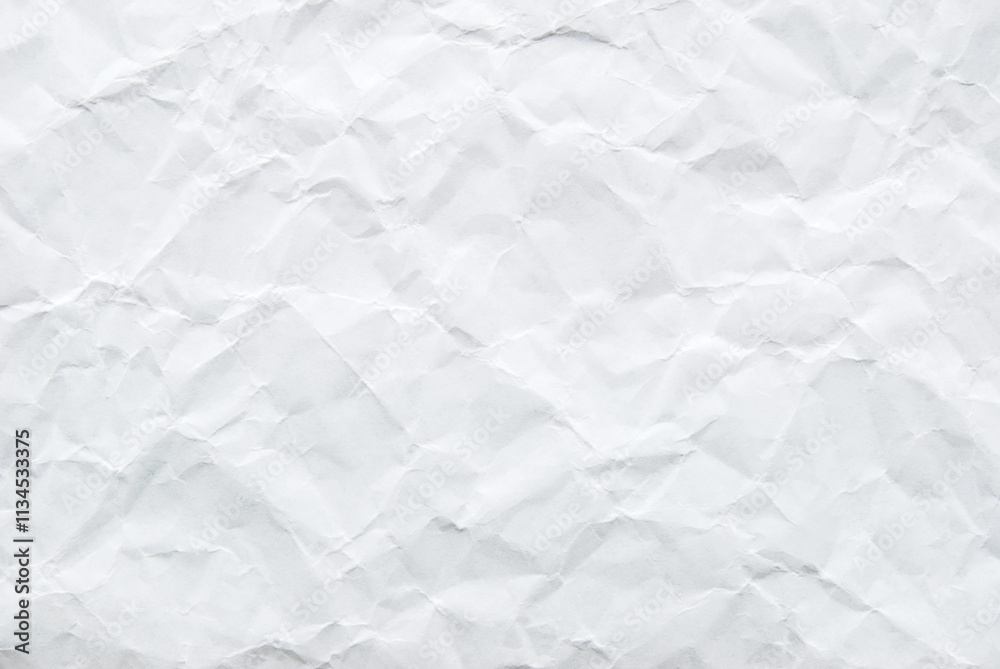 A sheet of white wrinkled paper texture as background A sheet of white wrinkled paper texture as background