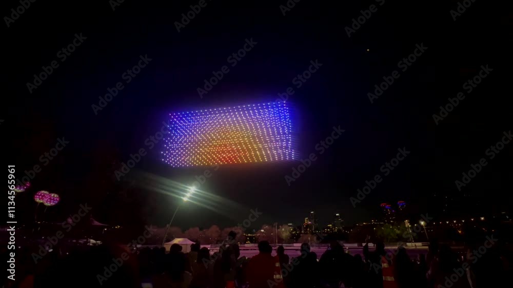 Seoul, South Korea - November 30, 2024 The final scene of the drone light show at night Drones with multi-colored lights, straight as taut threads, row by row return to base