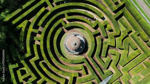 drone aerial video of landscape design green labyrinth in sunny day 