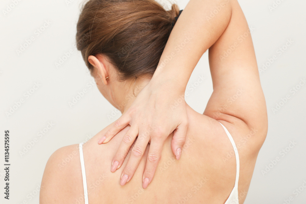 Back pain background. Relief for neck with massage. Rehabilitation and care for better health. Muscle tension rehabilitation. Physical therapy techniques. Muscle pain medicine. Woman isolated on white Back pain background. Relief for neck with massage. Rehabilitation and care for better health. Muscle tension rehabilitation. Physical therapy techniques. Muscle pain medicine. Woman isolated on white