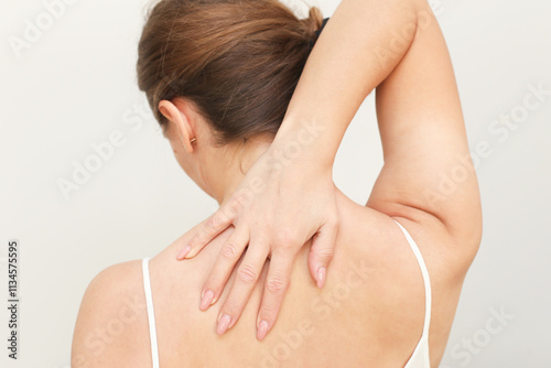 Back pain background. Relief for neck with massage. Rehabilitation and care for better health. Muscle tension rehabilitation. Physical therapy techniques. Muscle pain medicine. Woman isolated on white