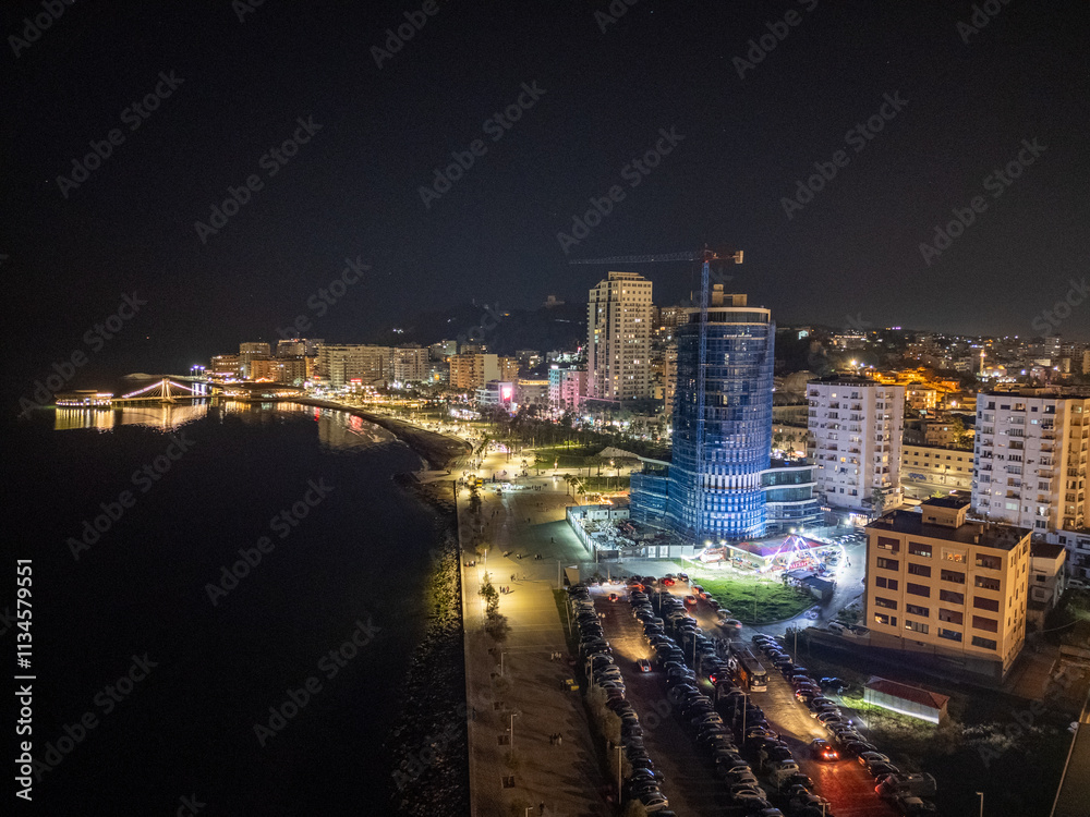 Obraz premium Aerial drone view of the coastal town of Durres in Albania by night.